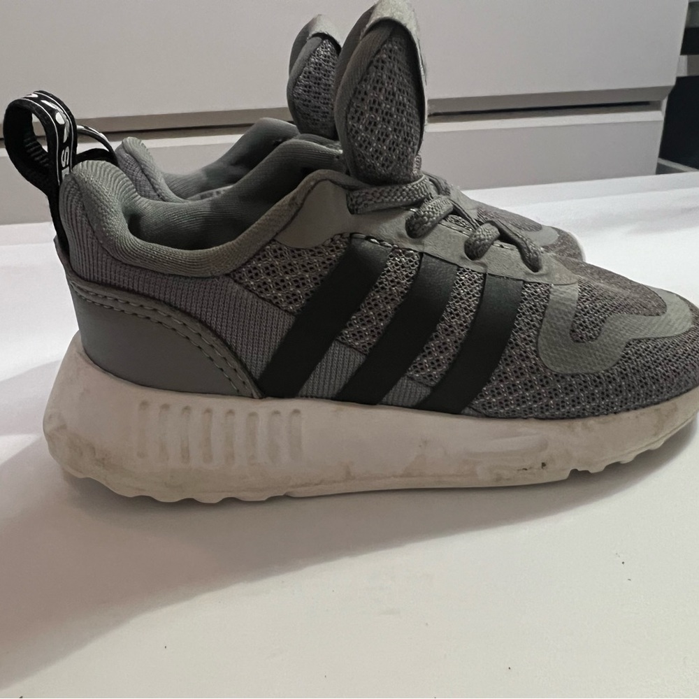 Kids Gray and Black Adidas tennis shoes